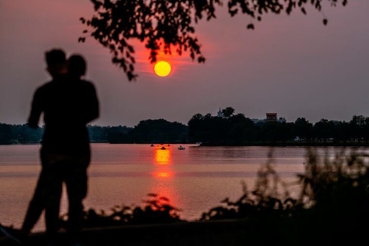 West Coast wildfire smoke makes for a vivid sunset in our region on Tuesday, setting over the Cooper River in Camden County.