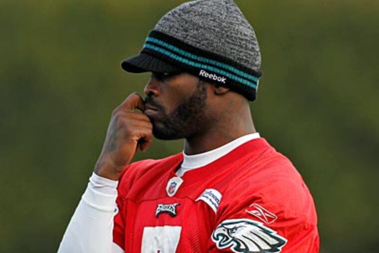 "I take a lot of hits," Eagles quarterback Michael Vick said. "It doesn't affect me. I get up from it." (Alex Brandon/AP)