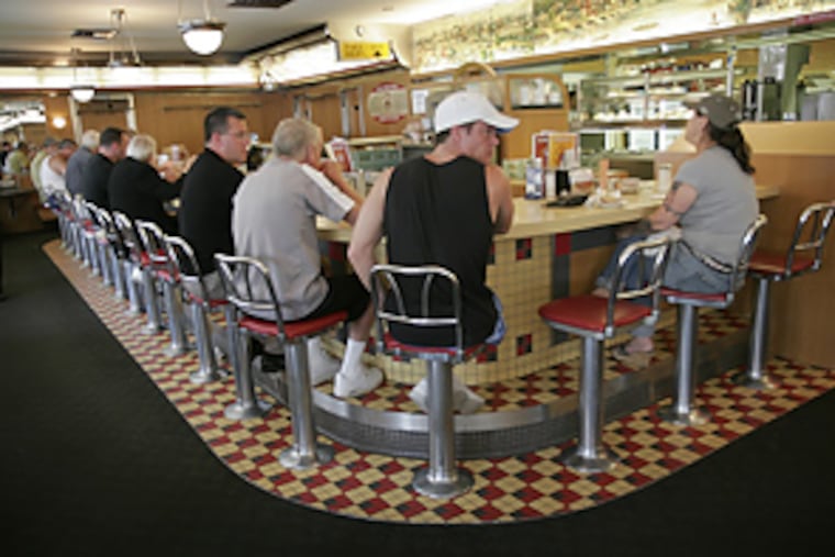 Diners at the counter of the Melrose Diner.