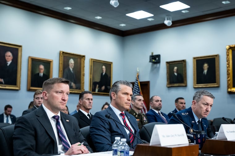 Defense Secretary Pete Hegseth, center, and Gen. Dan Caine, the chairman of the Joint Chiefs of Staff, right, testify before the House Appropriations subcommittee on Defense on Capitol Hill in Washington, on Tuesday, May 12, 2026.