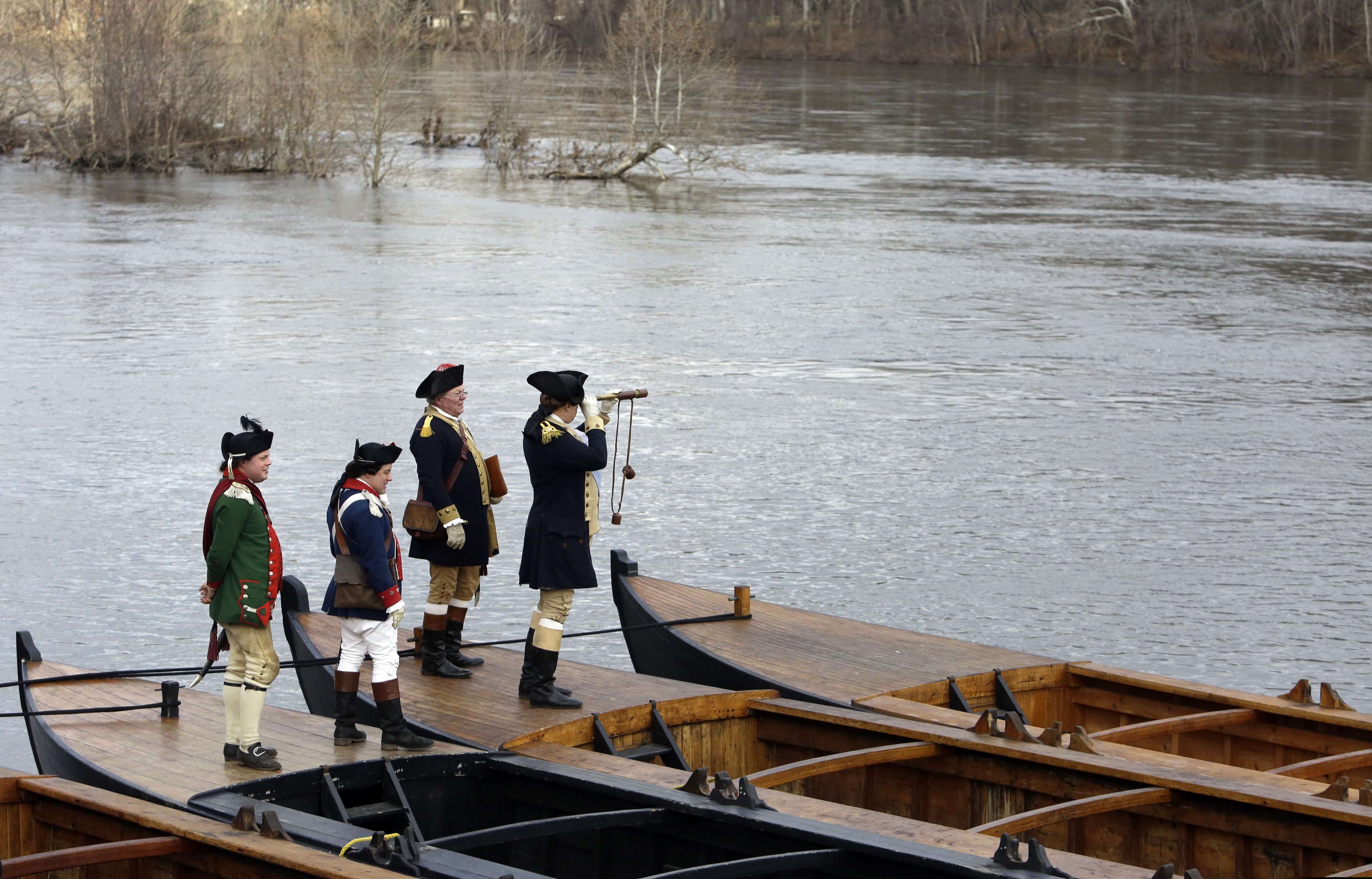A file photograph shows the 2018 reenactment events around Washington's crossing of the Delaware River. That year, flood waters prevented the boats from attempting it.