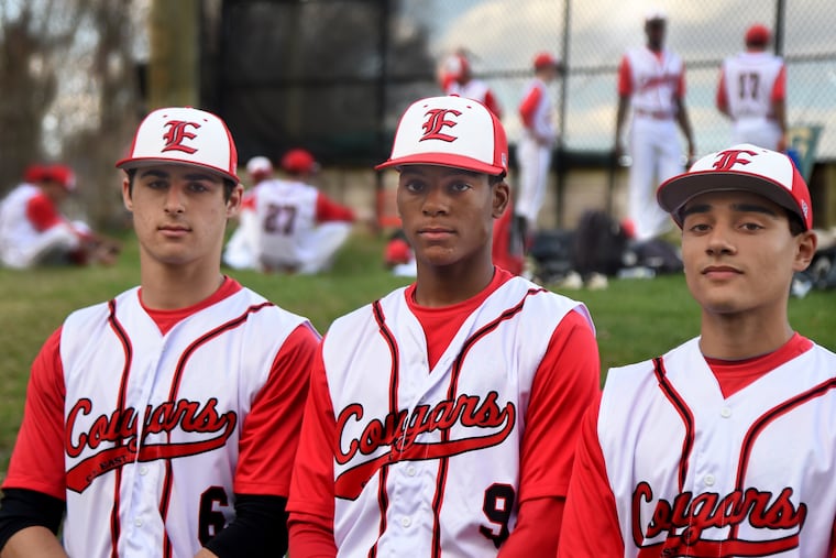 Cherry Hill High School East baseball players (from left) Ellis Schwartz, Alex Rodriguez and Even Gelman pose before their home game against Timber Creek April 10, 2019. They played together on 10-year-olds team that finished second in state. They are among eight players from that team on varsity.