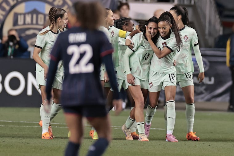 Portugal’s Fatima Pinto (center) celebrates with her team after scoring the game-deciding goal against the USWNT in the 72nd minute.