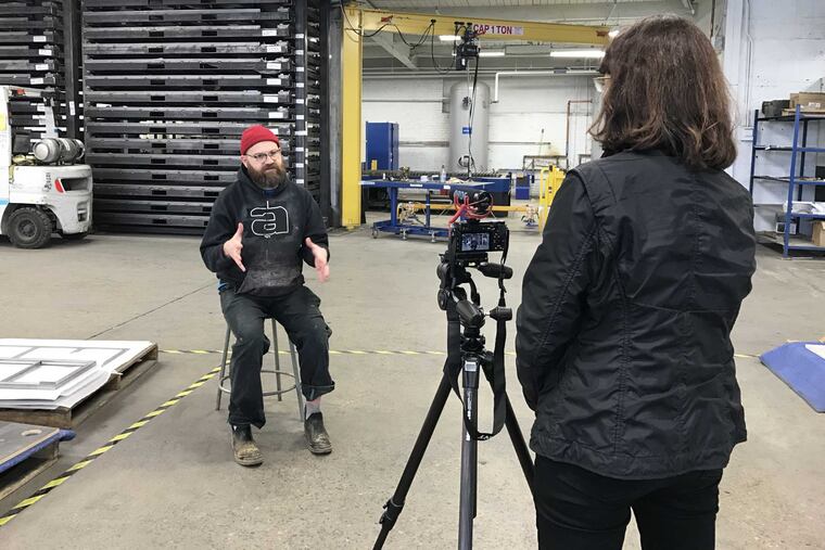 Architectural critic and curator Nina Rappaport films a Philadelphia factory worker as part of her exhibit, "A Worker's Lunch Box," which opened June 2 at Penn's Slought Gallery.