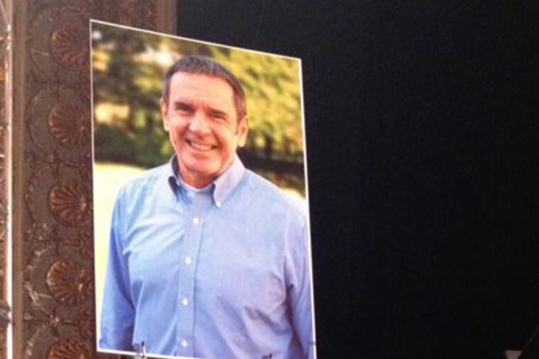 A poster and flowers on the stage at Keswick Theatre in Glenside, where a memorial service was held Monday for the late Rev. Terry Traylor, pastor of the nearby New Life Presbyterian Church, who died last Thursday (Dec. 12) from a massive heart attack.