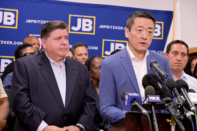Texas House Democratic Caucus Chair Gene Wu, along with other members of the Texas House, is joined by Illinois Gov. JB Pritzker as they speak about Texas Republicans' plans to redraw the House map office during a news conference at the Democratic Party of DuPage County office in Carol Stream, Ill., on Sunday.
