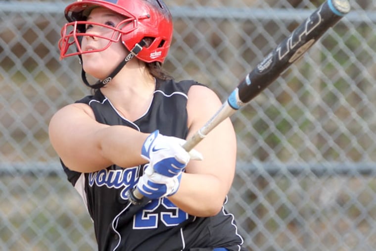 Alexa Naughton (left) of Springfield (Delco) hits a double with the bases loaded to drive in three runs in the 5th inning of their game against Radnor on April 10, 2013. (Charles Fox/Staff Photographer)