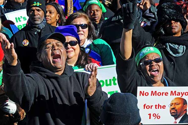 Rally at Independence Mall to honor Martin Luther King amid criticism of Nutter's failure to reach agreement with city unions on Jan. 19, 2013. Here, attendees Ronald Armour, left; and Eunice Grigsby. APRIL SAUL / Staff Photographer