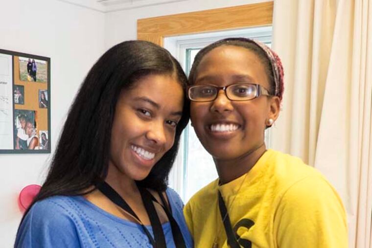 Sparkle Prevard, 18, a freshman at Stockton State College who grew up in Atlantic City and was left homeless at the age of 12 when her mom died. Sparkle will compete next month for the Boy's and Girl's Club Youth of the Year title in Washingtom. Here, on moving in day at Stockton Sparkle Prevard, right, with her new roommate Jasmine Norwood, 18, of Bear DE.( ED HILLE / staff photographer )