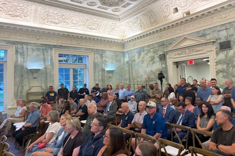 Cheltenham residents packed into Curtis Hall on Aug. 19 for a board of commissioners meeting that included the swearing in of the new police chief and comments about the Melrose pool project. The crowded dwindled to a handful near the end of the marathon four-hour meeting.