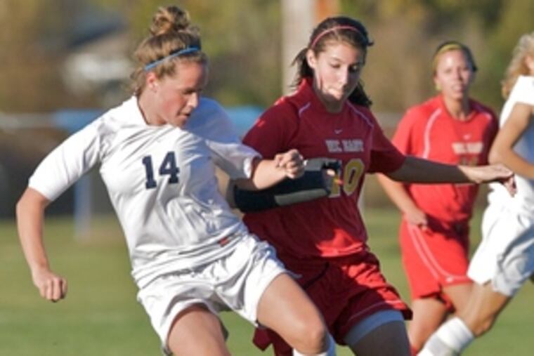 Upper Perkiomen's Hayley Tomilson, left, is challenged by West Chester East's Rebessa Burkhart.