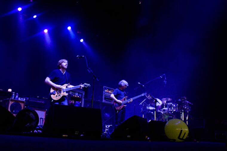 Phish performs. From left: Trey Anastasio, Mike Gordon, and Jon Fishman.