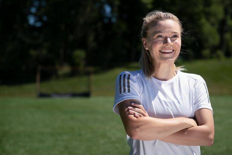 Emily Snowden poses for a portrait at a private turf field in Malvern, PA on Wednesday, July 29, 2020. Snowden has developed a niche business of helping field hockey goalies get better. It started as a part-time initiative to help her through grad school, but it is now her full-time job. She has resumed in-person instruction after doing virtual trainings in her parents basement during the initial months of the COVID-19 outbreak.