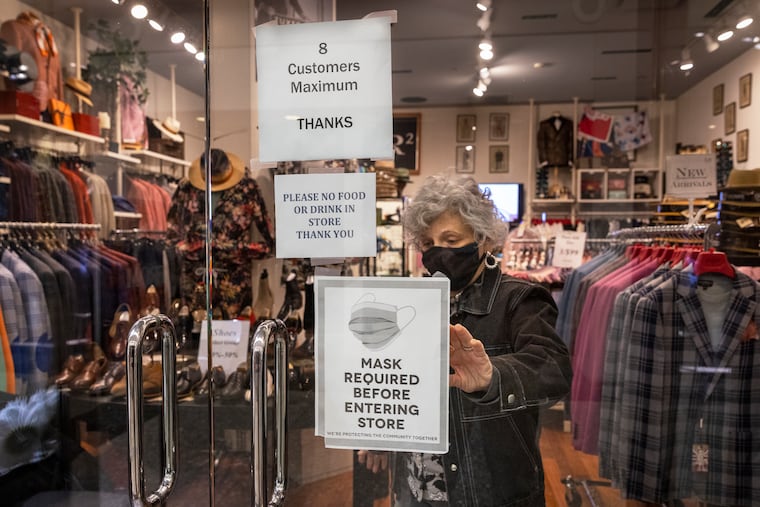 Melanie Schwartzberg, a salesperson with LR2 menswear clothing shop, inside The Shops at Liberty Place at 16th and Chestnut Streets in Philadelphia on Monday.