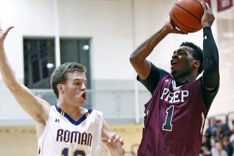 St. Joseph’s Prep guard Kyle Thompson puts up a shot while guarded by Roman Catholic’s Colin Flach during the second quarter of a Catholic League basketball quarterfinal Friday, Feb. 17, 2017 at Philadelphia University. Roman went on to win, 56-55.