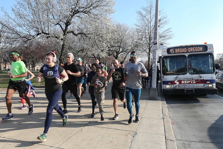 The start of the Clean Air Council's Race the Bus, where runners try to out run a bus from Broad and Oregon to 11th and Market. Runners traveled up 11th Street for most of the race. The bus had to stop for riders and follow all traffic rules.
