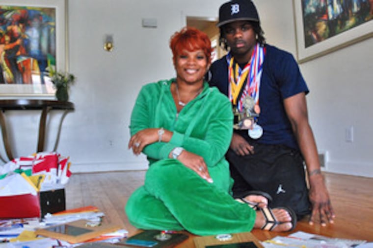 Cheltenham sprinter Brandon Bing (right) plans to sign a national letter of intent by next week to either Pitt or Rutgers, an early Mother's Day present to his mother, Gwendolyn (left).