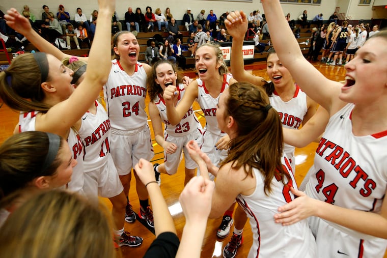 The Germantown Academy girls' basketball team huddles before their game against Notre Dame on Jan. 15, 2016. ( CHARLES FOX / Staff Photographer )