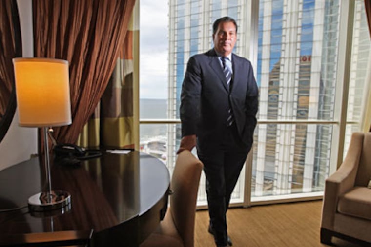 Trump Entertainment Co. CEO Mark Juliano enters his second year at the helm, much is riding on the new Chairman Tower hotel that will debut this Labor Day weekend. Here Mark Juliano stands in one of the singles rooms in the Chairman's Tower as the Taj Mahal tower looms in the window. (Michael Bryant/Inquirer)