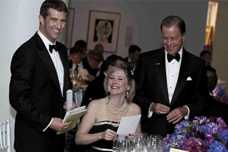 Jonathan Hochman (left), Veronica McKee, and Chuck Homer were among guests at the Bacchanal Wine Gala and Auction. (Photo / David Hershey)