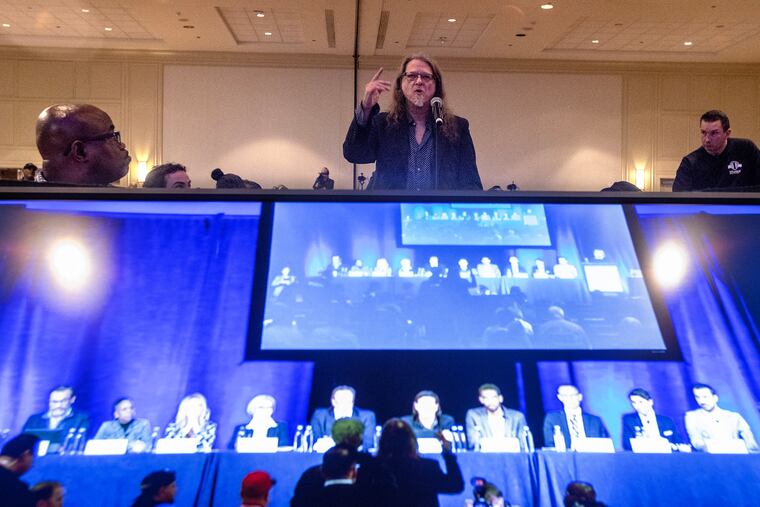 The Sixers invited the public to come and ask questions about their proposed 76er Place project on East Market St. A man wishing to be only identified as a concerned citizen asks a question of the panel (shown on a video monitor) on Nov. 16, 2023.