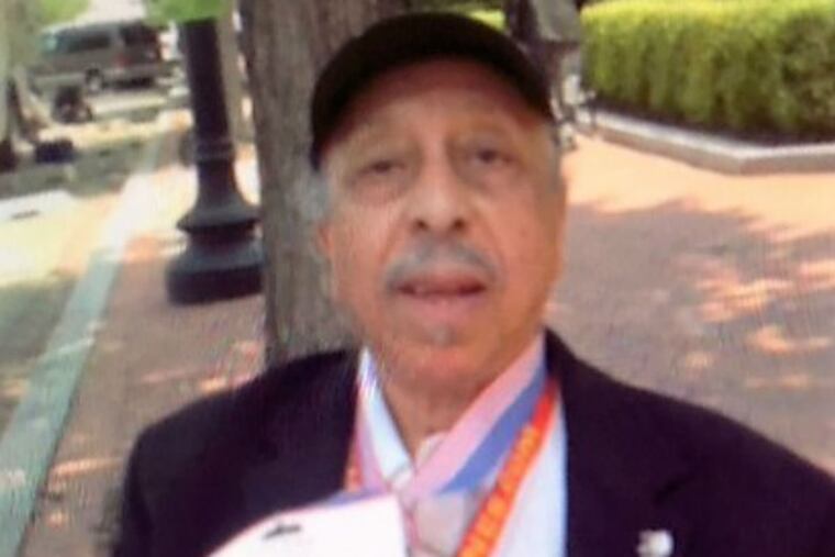 William Theodore Carney Jr. showing off his replica of the Congressional Gold Medal that was given to the Montford Marines as a group in June 2012.