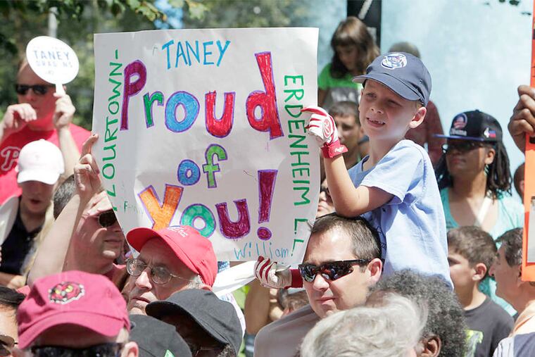 A young fan shows some Dragon love at LOVE Park. Next up for the Taney team: a parade Wednesday.