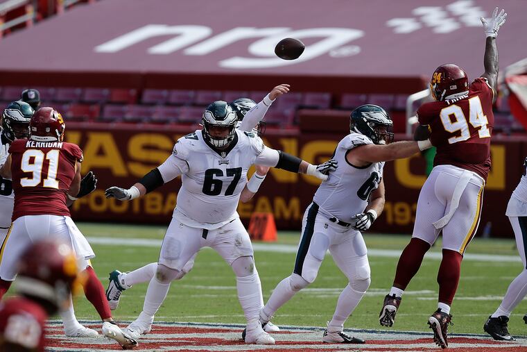 Nate Herbig (67) pass protects for Carson Wentz against Washington.