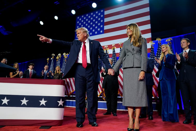 President-elect Donald Trump points to supporters as he leaves the stage after an election night party in West Palm Beach, Florida, early Wednesday morning.