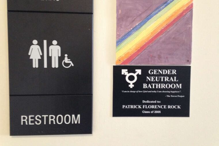 The sign on the gender-neutral bathroom at Jack M. Barrack Hebrew Academy in Bryn Mawr was designed by students, who were inspired by an alumnus to have a dedicated facility.