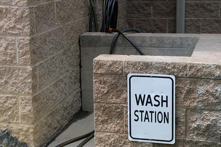 Marcellus Shale workers can wash off their boots and gear outside the hotels. ANNA BENTLEY / Pittsburgh Post-Gazette