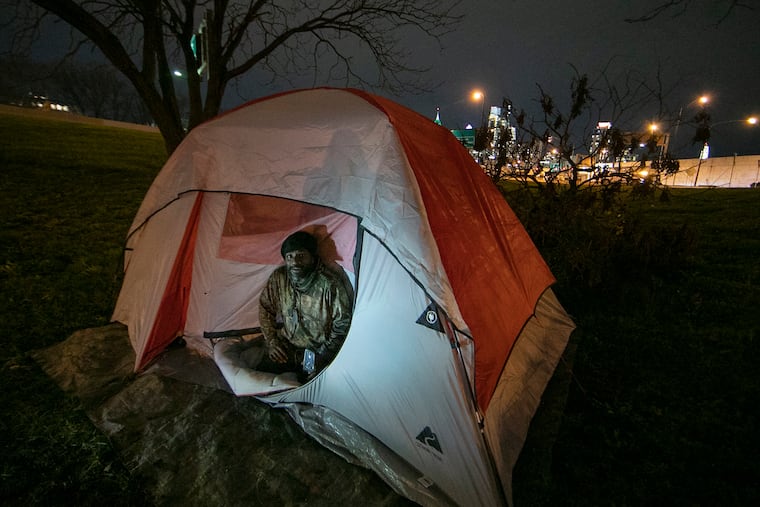 Duran Allen-Brown at his tent that is along I-676 near 6th St. in Philadelphia in December. The city is expecting to get $42 million from the federal government to be used to help people experiencing homelessness.