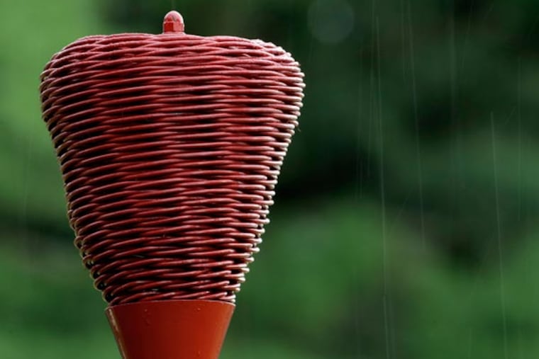 Raindrops fall on a wicker basket as weather delays the first round of the U.S. Open golf tournament at Merion Golf Club, Thursday, June 13, 2013, in Ardmore, Pa. (Julio Cortez/AP)