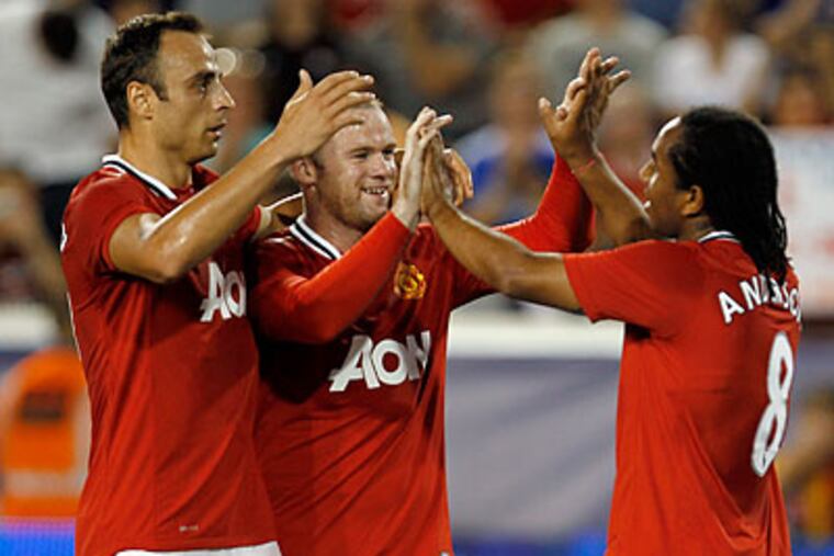 Anderson (right) scored one of Manchester United's four goals against the MLS All-Stars. (Julio Cortez/AP)