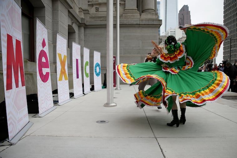 Patrick Tierney (left) and Mariana Gomez, of Ballet Folklorico Yaretzi, dance during a Mexican flag-raising ceremony in advance of Cinco de Mayo in Philadelphia on May 3, 2019.
