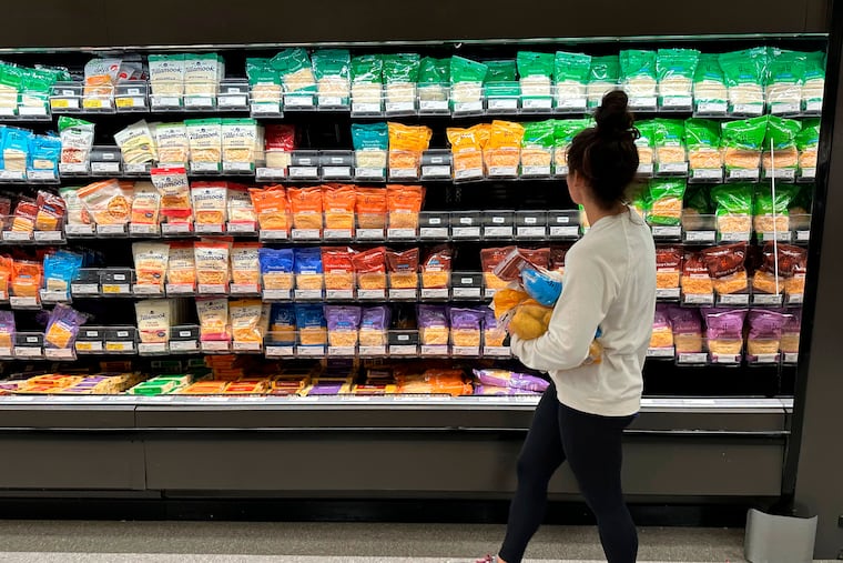 FILE - A shopper peruses cheese offerings at a Target store Wednesday, Oct. 4, 2023, in Sheridan, Colo.