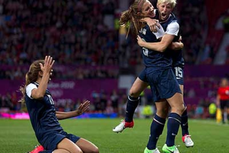 Alex Morgan (center) scored the winning goal as the United States topped Canada, 4-3. (Jon Super/AP)