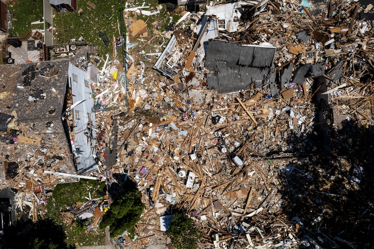 Debris covers the site of an explosion at the corners of Butler Avenue and Hale Street in Pottstown, Pa. on Tuesday, May 31, 2022. Five people were killed in the explosion last Thursday, four children and one adult. As of Tuesday morning, the source and origin point of the explosion had not been released.