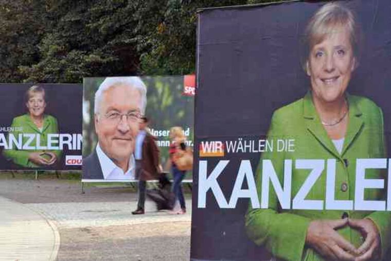 Posters for Chancellor Angela Merkel and Frank-Walter Steinmeier , her vice chancellor and election challenger, are seen in Berlin. The coalition partners - she's a Christian Democrat, he's a Social Democrat - have worked together well for four years.