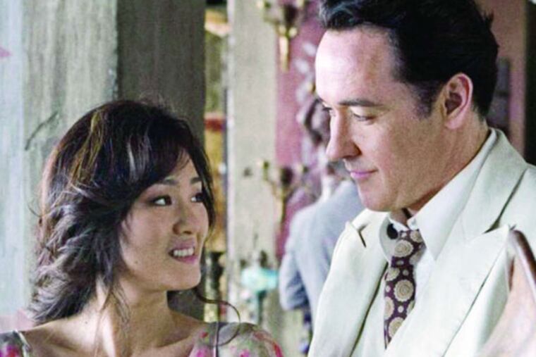 Li Gong and John Cusack are spies from two ends of the globe tangled in WWII subplot in "Shanghai."