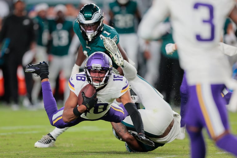 Vikings wide receiver Justin Jefferson is brought down after a catch against the Eagles on Sept. 14, 2023.