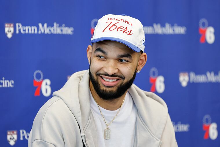 The 76er's second-round draft pick, center-forward Johni Broome, smiles while meeting with the media during an introductory press conference at the team's training complex in Camden.