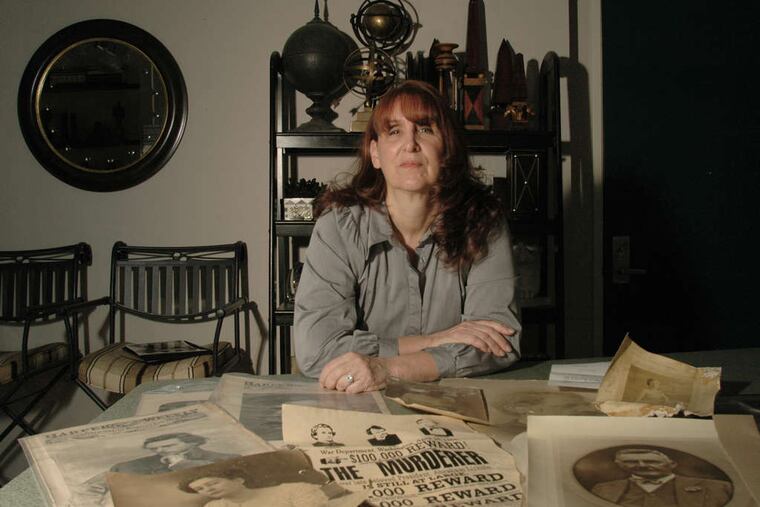 Joanne Hulme of Kensington with photos of members of the Booth family, of which she is a member. "His siblings spoke wonderfully of him," she said.