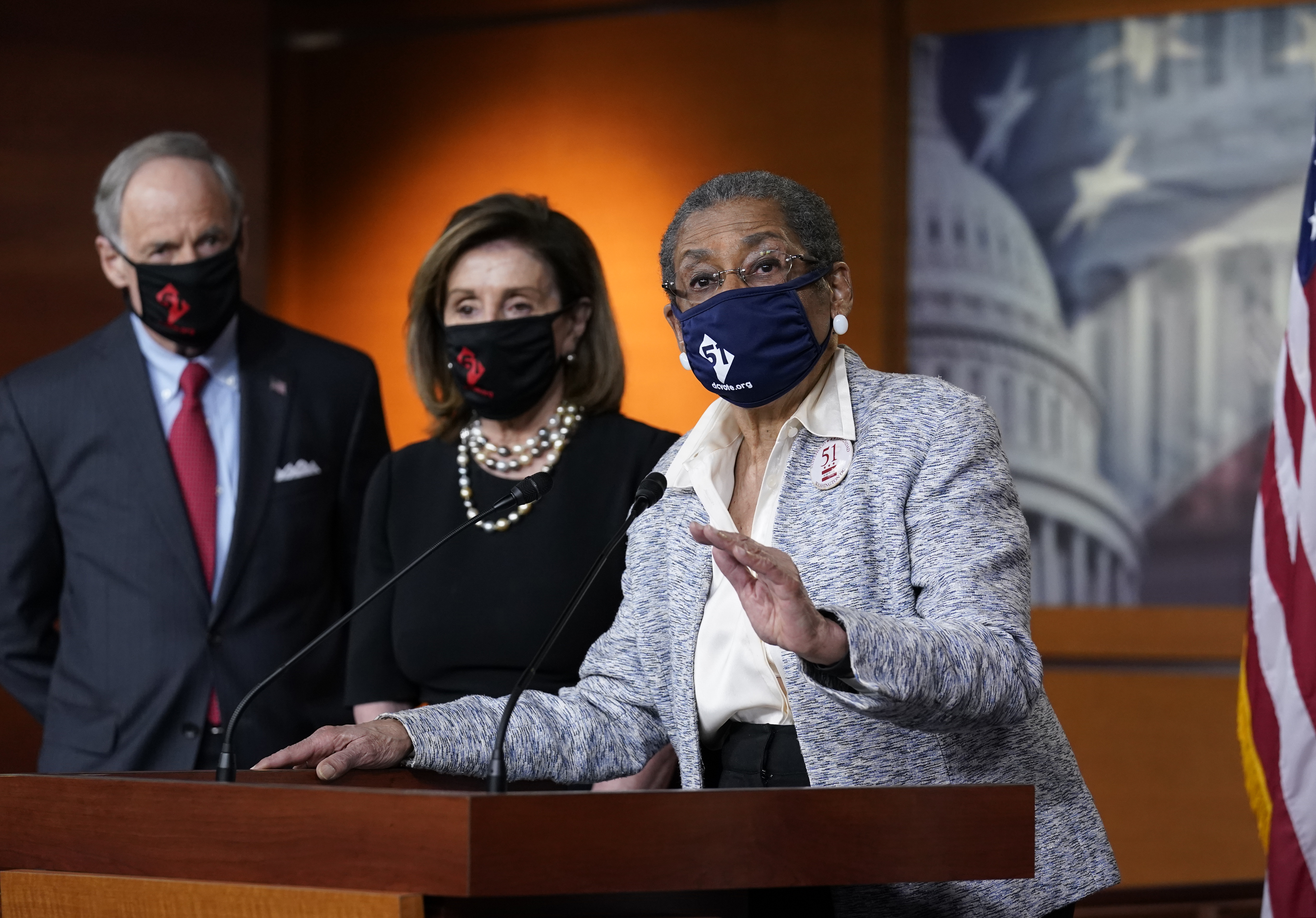 Del. Eleanor Holmes-Norton, D-D.C., center, joined from left by Sen. Tom Carper, D-Del., and House Speaker Nancy Pelosi, D-Calif., speaks at a news conference ahead of the House vote on H.R. 51- the Washington, D.C. Admission Act.