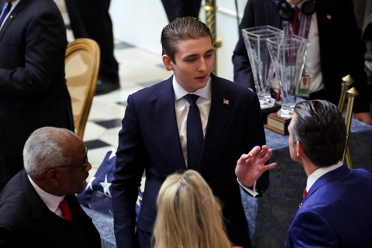 Barron Trump speaks to Pete Hegseth on Capitol Hill following the inaugural ceremonies for his father on Jan. 20, 2025, in Washington. The Secret Service says it is aware of a video threat against him.