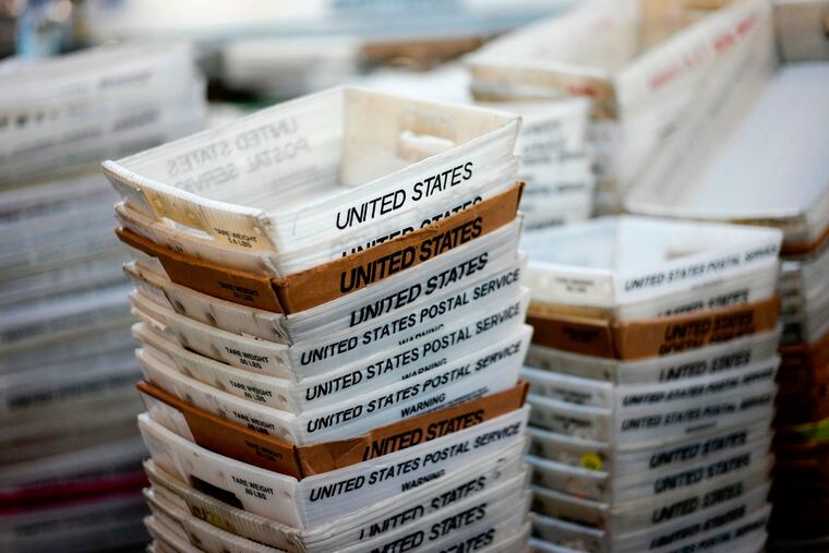 FILE- Boxes of sorted mail at the main post office in Omaha, Neb. Hundreds of boxes like these with apparently undelivered mail were found on a Philadelphia street.