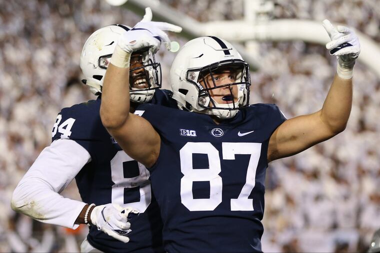 Penn State's Juwan Johnson (84) and Pat Freiermuth (87) celebrating a touchdown Saturday against Ohio State.