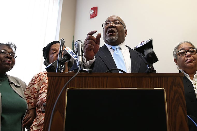 State Rep. W. Curtis Thomas, center, calls for the elimination of School Reform Commission during a news conference at his office in Philadelphia on October 9, 2014. ( DAVID MAIALETTI / Staff Photographer )