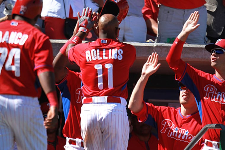 Phillies' Jimmy Rollins hits a three run homer in the third inning. (David Swanson/Staff Photographer)