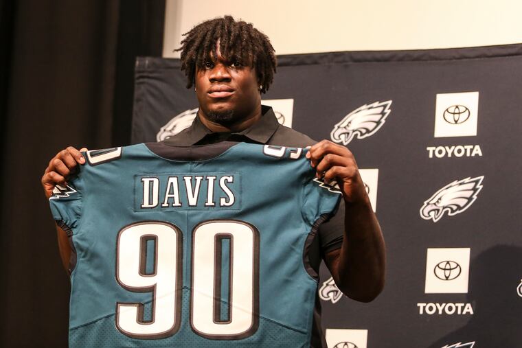 Eagles introduce first-round draft pick Jordan Davis holding his jersey at the Nova Care Center, Friday, April 29, 2022